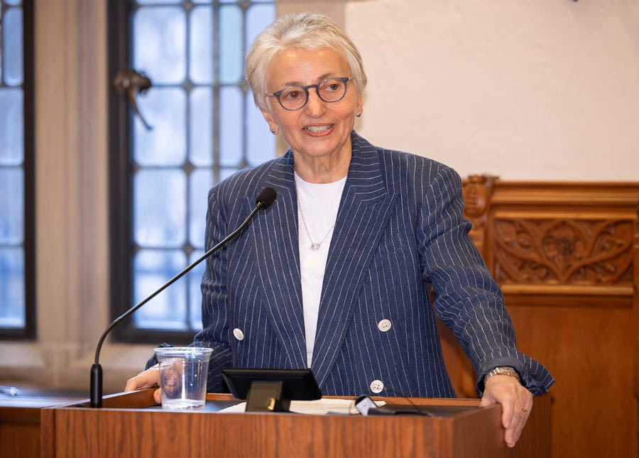 Photo of carolyn mazure, a pioneering leader in women’s health, equity, speking at a podium